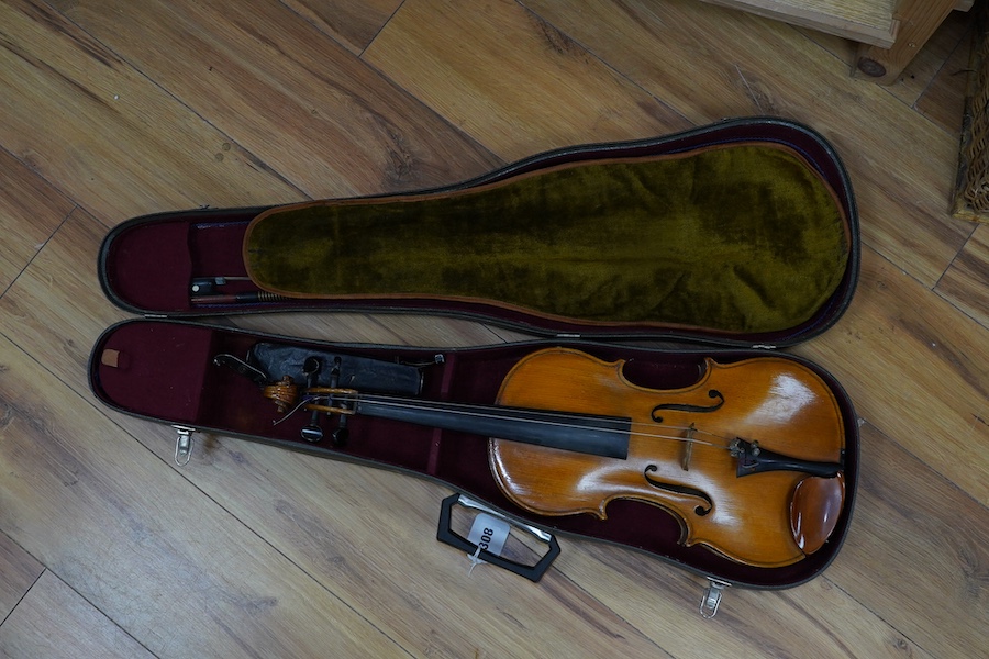 A cased early 20th century European violin, with label reading ‘Antonius Stradivarius Cremonenfis’, body length 36cm, with P&H London bow. Condition - good